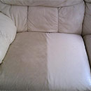 A partially cleaned leather sofa